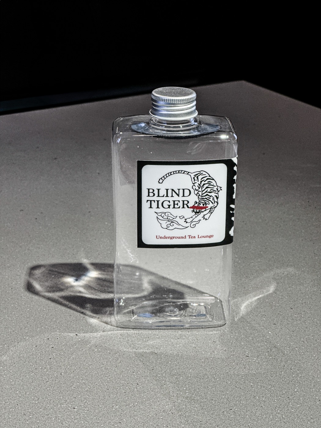 The original Blind Tiger prototype flask with a handmade label